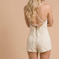 Washed Denim V-Neck Romper with Pleat Detail & Tie Straps