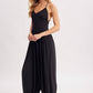 V-NECK RELAXED FLOWY LEGS JUMPSUIT CRISS-CROSS OPEN BACK