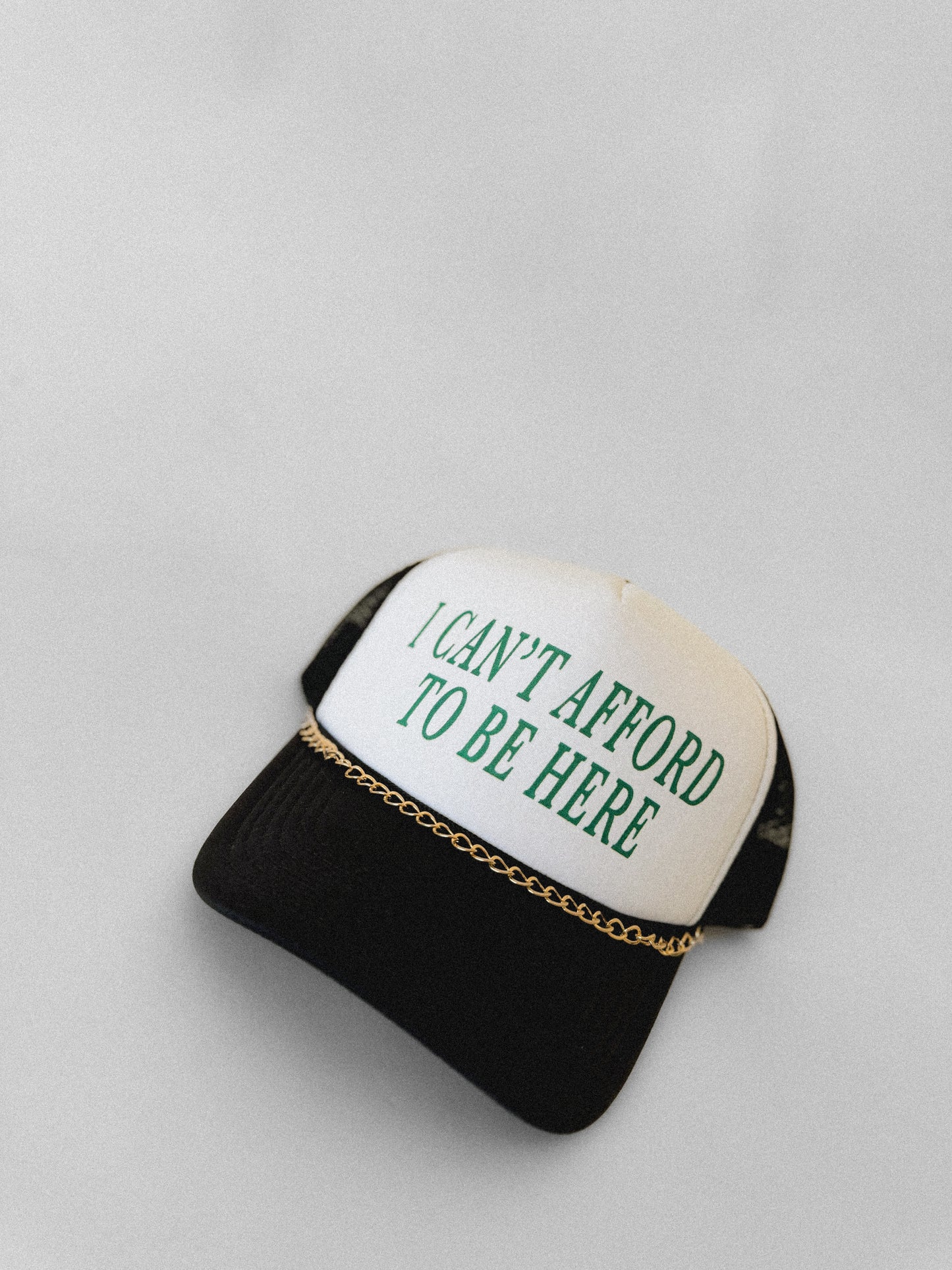 I Can't Afford To Be Here Trucker Hat