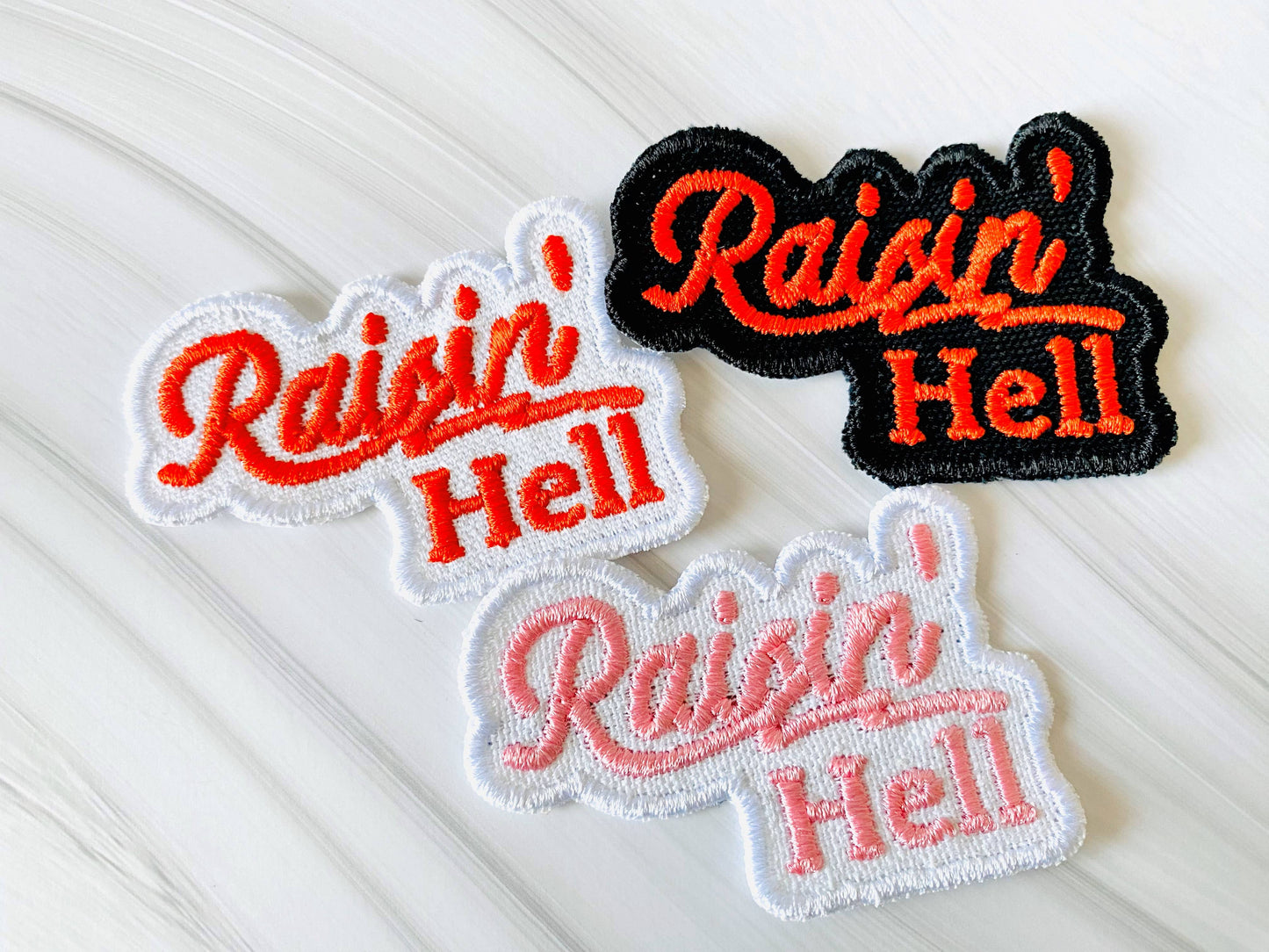 Raisin' hell embroidered iron-on hat patch