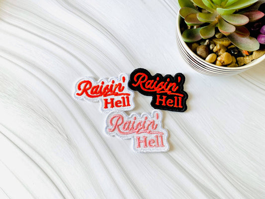 Raisin' hell embroidered iron-on hat patch
